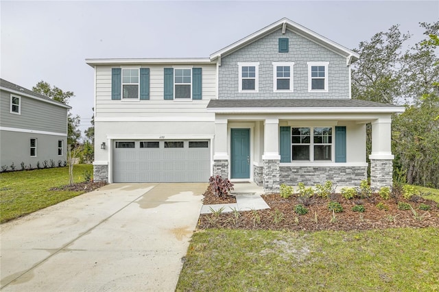 view of front of house featuring a front yard and a garage