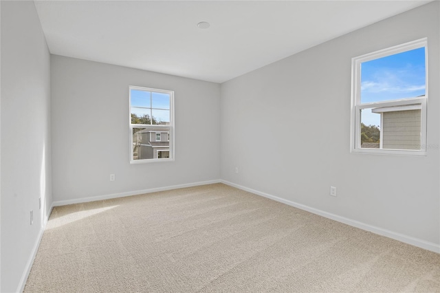 unfurnished room featuring carpet floors