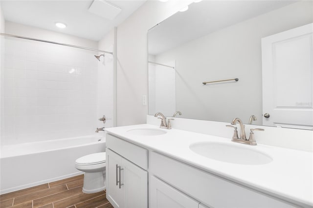 full bathroom featuring bathtub / shower combination, vanity, and toilet