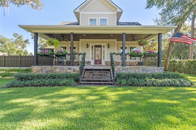 view of front of home featuring covered porch and a front yard