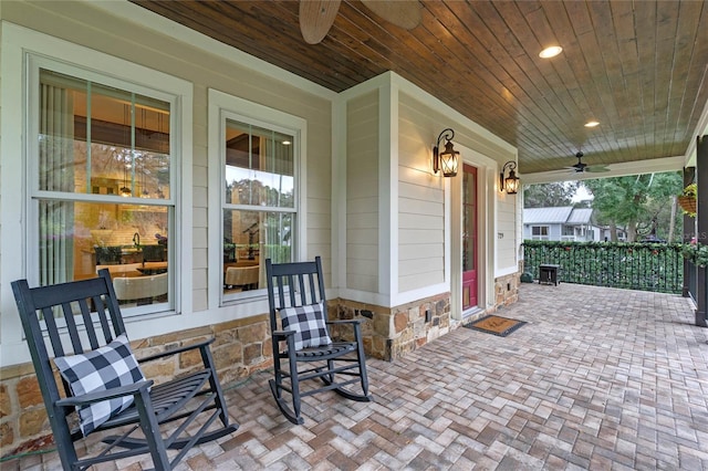 view of patio / terrace with ceiling fan and a porch