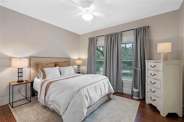 bedroom featuring ceiling fan and dark hardwood / wood-style flooring