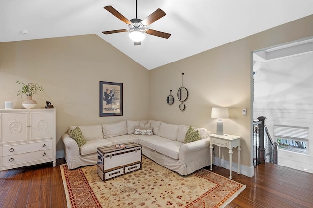 living room with hardwood / wood-style floors, ceiling fan, and vaulted ceiling