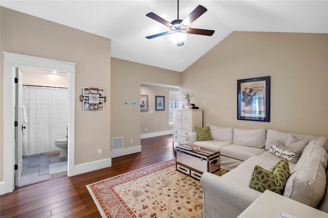 living room featuring dark hardwood / wood-style floors, ceiling fan, and lofted ceiling