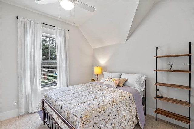 carpeted bedroom with vaulted ceiling and ceiling fan