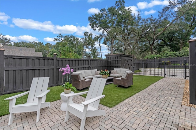 view of patio / terrace with an outdoor living space and a storage unit