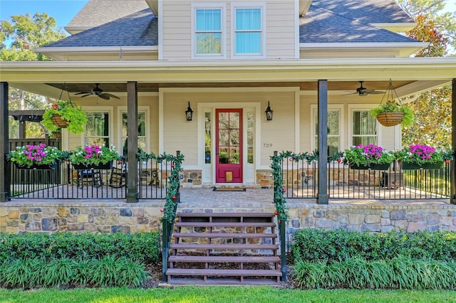 entrance to property with a porch and ceiling fan