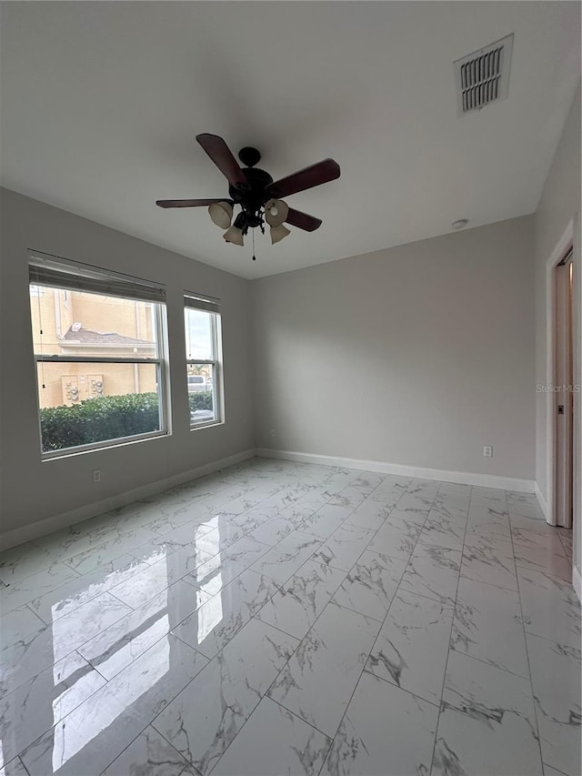 spare room with ceiling fan