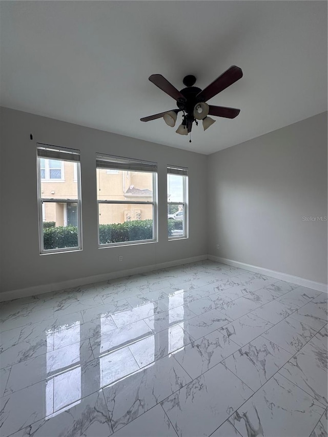 unfurnished room with plenty of natural light and ceiling fan