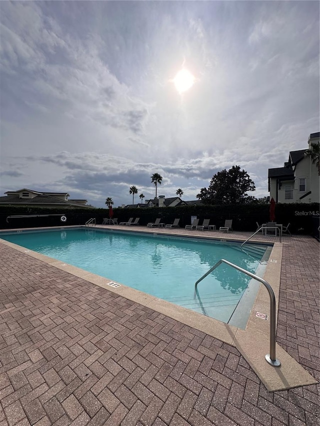 view of swimming pool featuring a patio