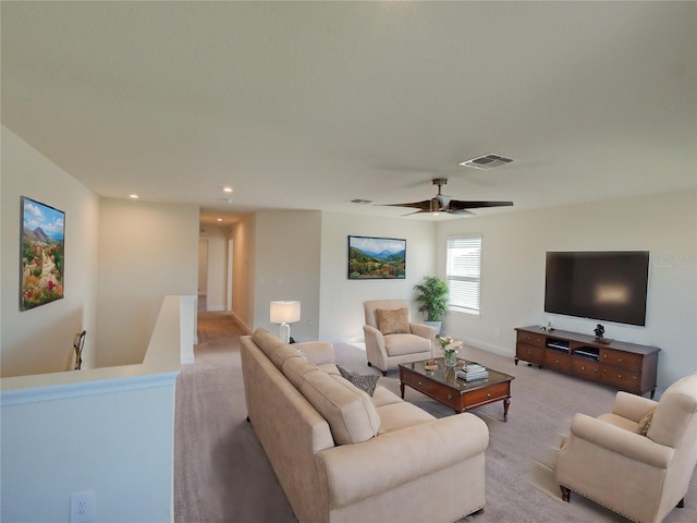 living room with ceiling fan and light carpet