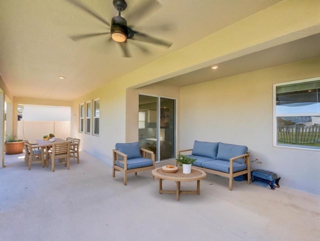 view of patio / terrace with ceiling fan and an outdoor living space