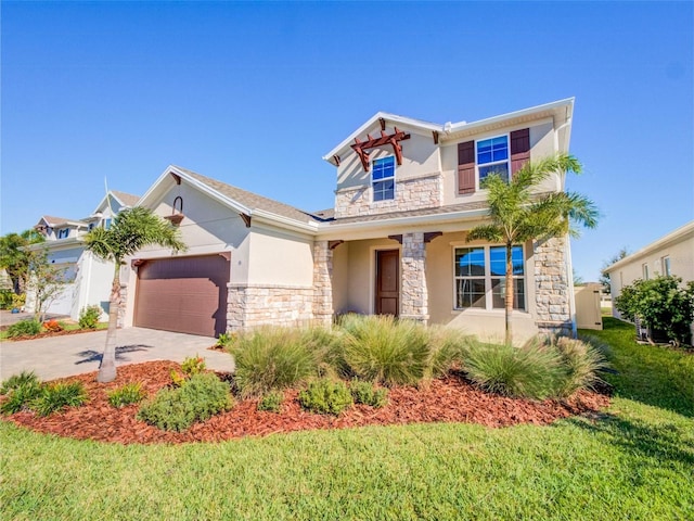 view of front of home featuring a garage and a front yard