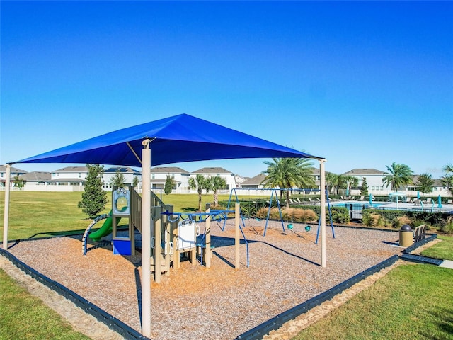 view of playground featuring a lawn