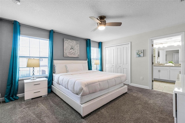 bedroom featuring multiple windows, ceiling fan, and dark colored carpet