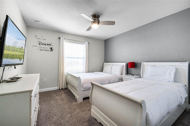 carpeted bedroom with ceiling fan and a textured ceiling