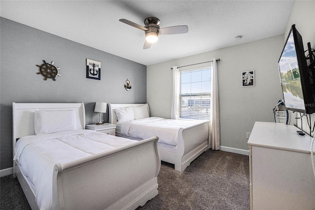 bedroom with dark colored carpet and ceiling fan