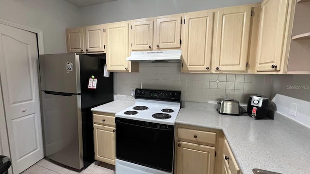 kitchen with decorative backsplash, stainless steel fridge, white electric stove, and light brown cabinetry