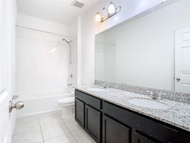 full bathroom with tile patterned floors, toilet, vanity, and tiled shower / bath