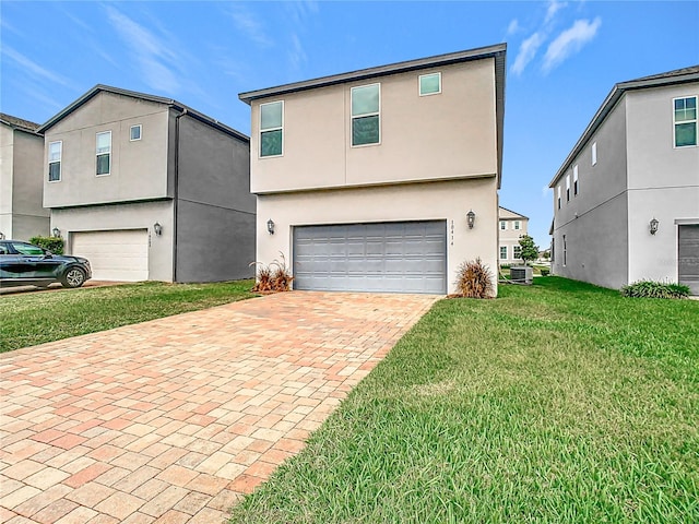 view of front property featuring a garage, a front lawn, and central air condition unit