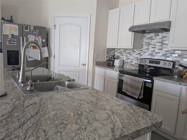 kitchen with sink, backsplash, white cabinetry, and stainless steel appliances