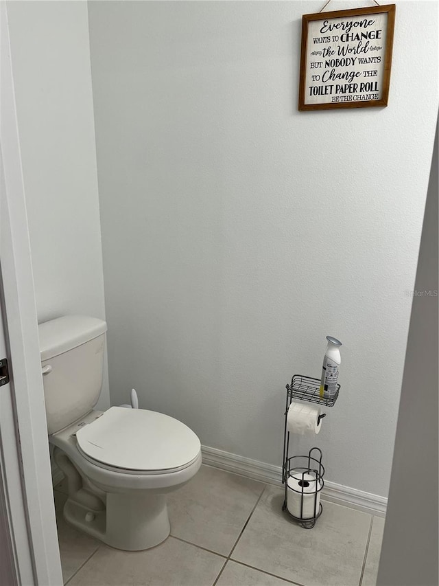 bathroom featuring tile patterned flooring and toilet