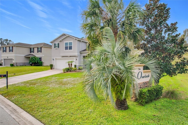 view of front of house featuring a garage and a front yard