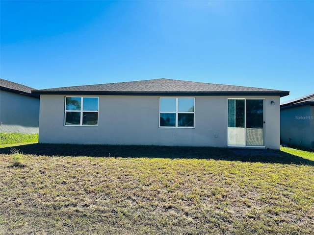 view of side of home featuring a lawn