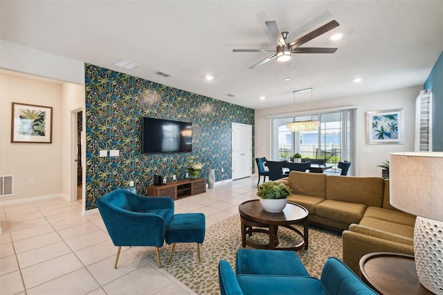 living room with ceiling fan and light tile patterned floors