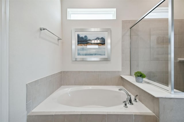 bathroom with tiled bath