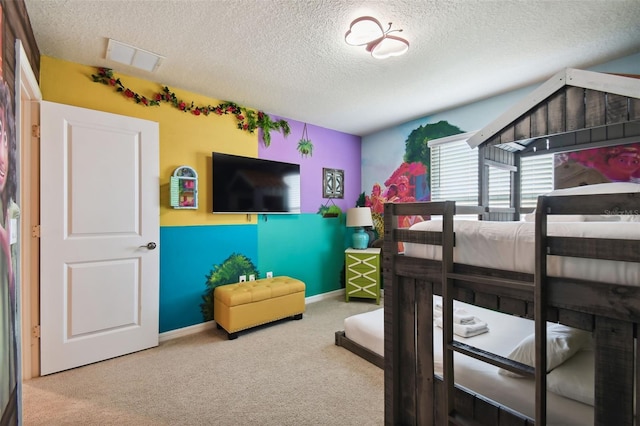 carpeted bedroom with a textured ceiling