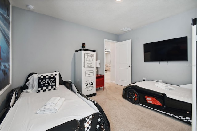 bedroom featuring light colored carpet