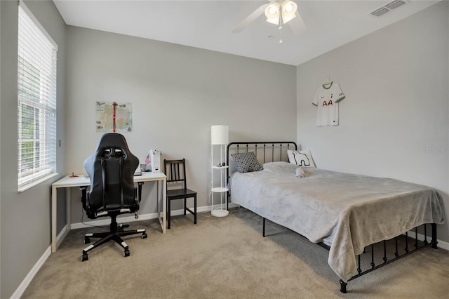 carpeted bedroom with ceiling fan