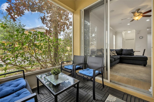 exterior space with a wealth of natural light and ceiling fan