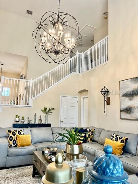 living room featuring a high ceiling