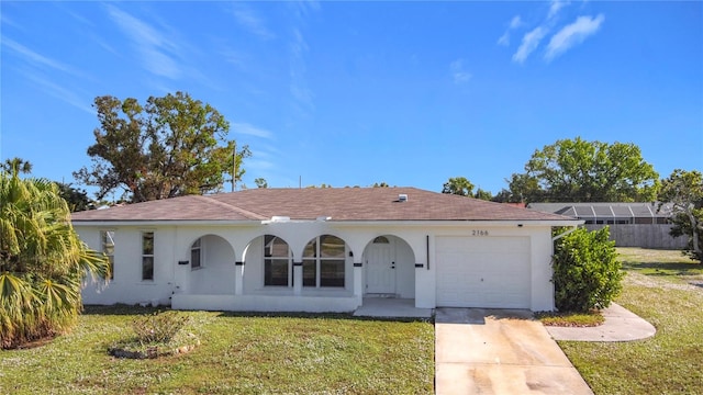 view of front facade with a garage and a front yard