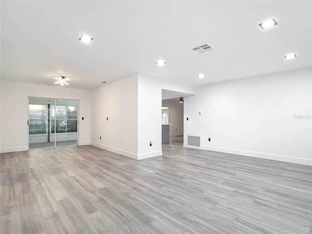 unfurnished room featuring light hardwood / wood-style floors