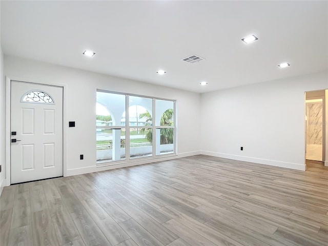 unfurnished living room with light hardwood / wood-style floors