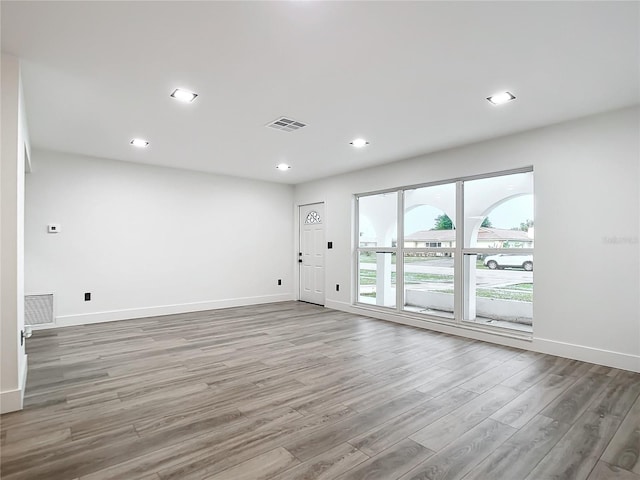 unfurnished room featuring light hardwood / wood-style flooring