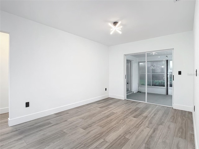 spare room with light hardwood / wood-style floors