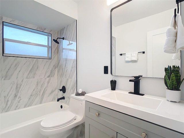 full bathroom with vanity, toilet, and tiled shower / bath