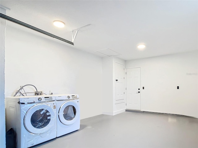 laundry room featuring washing machine and clothes dryer