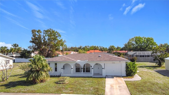 view of front of property with a porch, a garage, and a front lawn