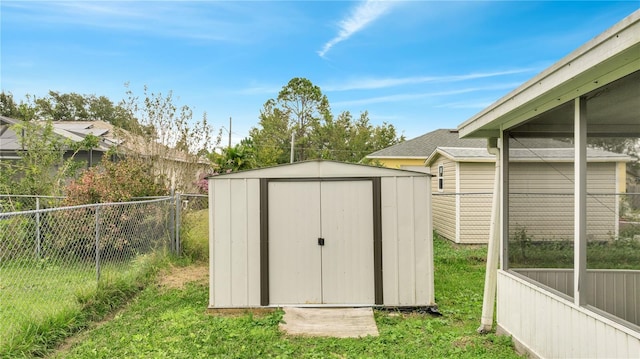 view of outbuilding with a yard