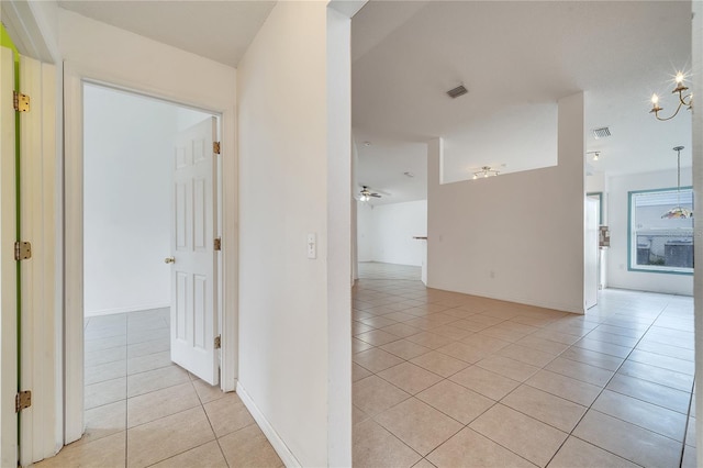 hallway with light tile patterned floors