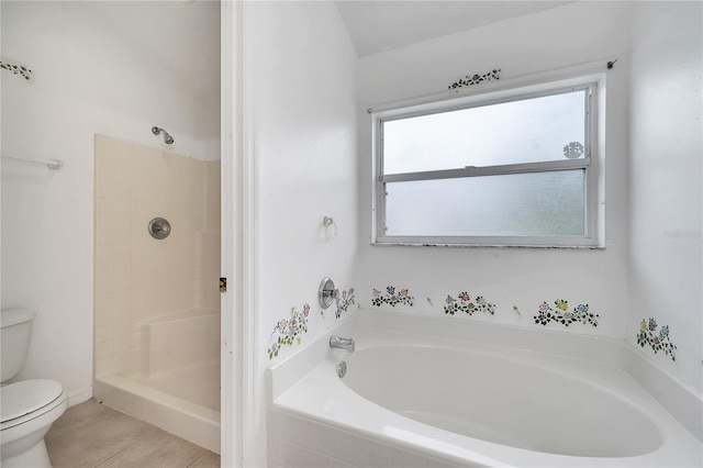 bathroom featuring tile patterned floors, toilet, and shower with separate bathtub