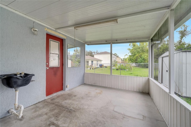 unfurnished sunroom with a wealth of natural light