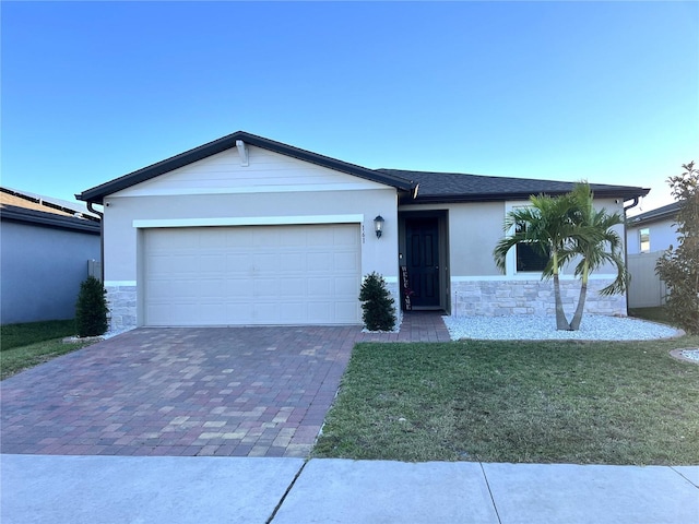 ranch-style house with a garage and a front yard