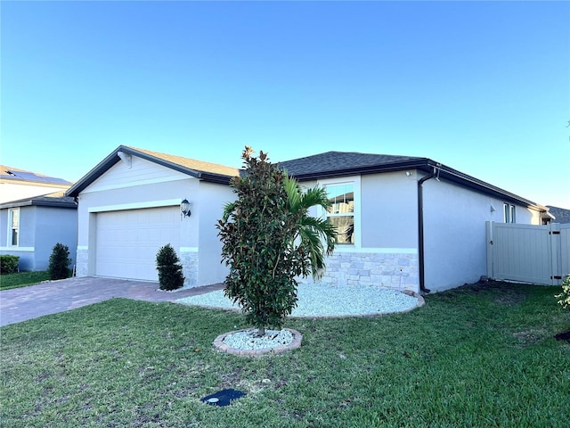 view of front of house with a garage and a front yard