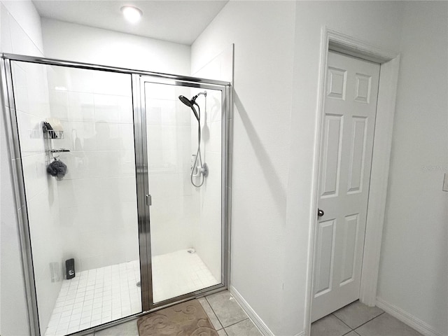 bathroom featuring tile patterned floors and an enclosed shower